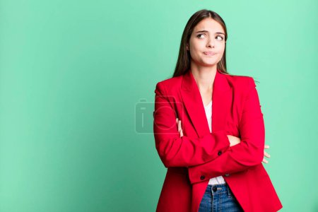 Photo for Young pretty woman shrugging, feeling confused and uncertain. businesswoman concept - Royalty Free Image
