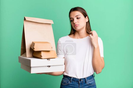 Photo for Young pretty woman feeling stressed, anxious, tired and frustrated. delivery and take away concept - Royalty Free Image