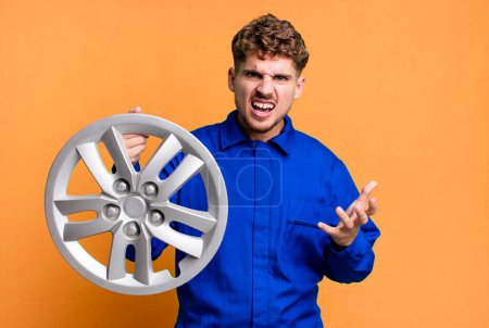 Photo for Young adult caucasian man looking angry, annoyed and frustrated. car repairman or mechanic concept - Royalty Free Image