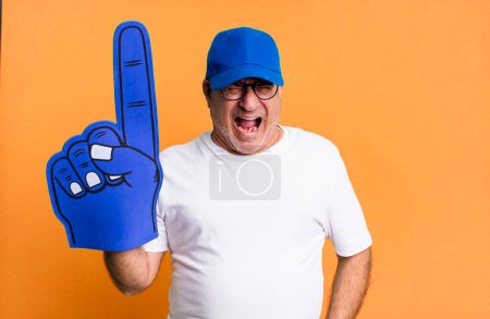 Photo for Middle age senior man shouting aggressively, looking very angry. number one fan concept - Royalty Free Image