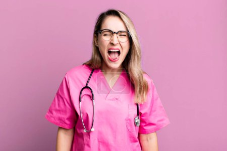 Photo for Shouting aggressively, looking very angry. nurse concept - Royalty Free Image