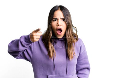Photo for Hispanic pretty woman pointing at camera with an angry aggressive expression looking like a furious, crazy boss - Royalty Free Image