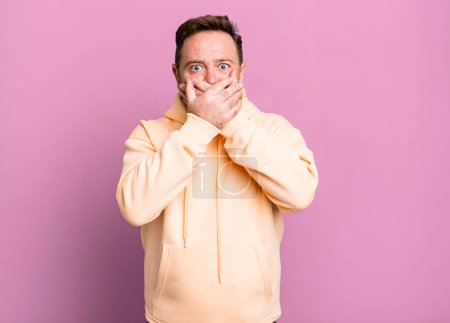Photo for Covering mouth with hands with a shocked, surprised expression, keeping a secret or saying oops - Royalty Free Image