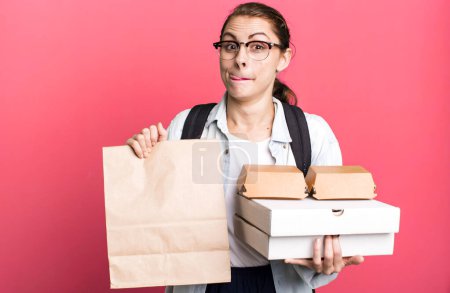 Photo for Young adult pretty woman with take away delivery fast food boxes - Royalty Free Image