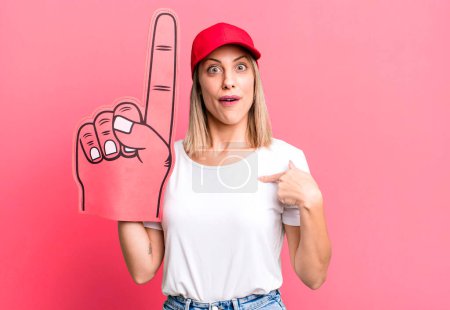 Photo for Pretty blonde woman feeling happy and pointing to self with an excited. number one fan concept - Royalty Free Image