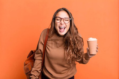 Photo for Hispanic pretty woman shouting aggressively, looking very angry. take away coffee concept - Royalty Free Image