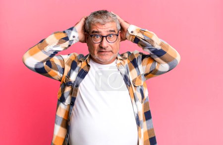 Photo for Middle age senior man feeling stressed, worried, anxious or scared, with hands on head, panicking at mistake - Royalty Free Image