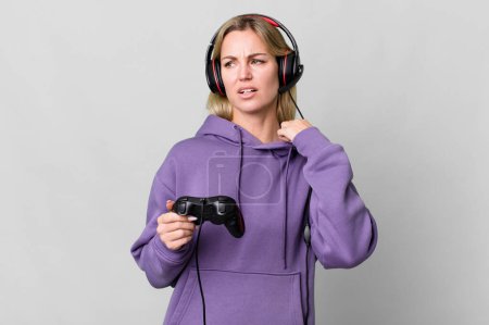 Photo for Caucasian blonde woman feeling stressed, anxious, tired and frustrated. gamer concept - Royalty Free Image