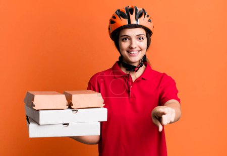 Photo for Young pretty woman pointing at camera choosing you. pizza delivery concept - Royalty Free Image