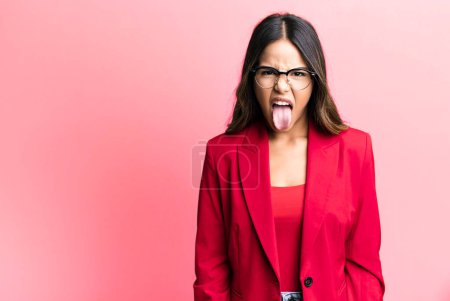 Photo for Hispanic pretty woman feeling disgusted and irritated and tongue out. businesswoman concept - Royalty Free Image