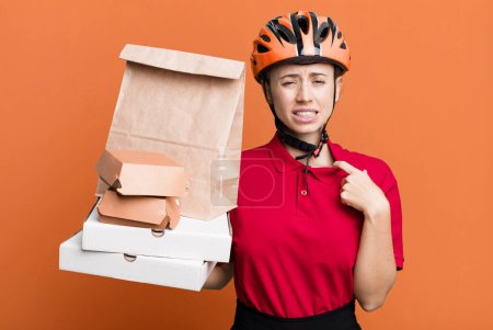 Foto de Feeling stressed, anxious, tired and frustrated. fast food delivery or take away - Imagen libre de derechos