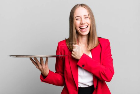 Photo for Feeling happy and facing a challenge or celebrating. businesswoman presenting with a tray - Royalty Free Image