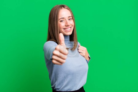 Photo for Feeling proud, carefree, confident and happy, smiling positively with thumbs up - Royalty Free Image