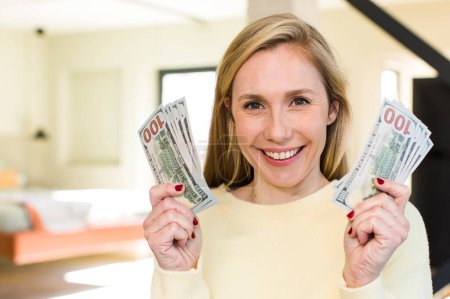 Photo for Young adult pretty blonde woman with banknotes - Royalty Free Image