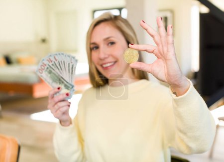 Photo for Young adult pretty blonde woman with banknotes - Royalty Free Image