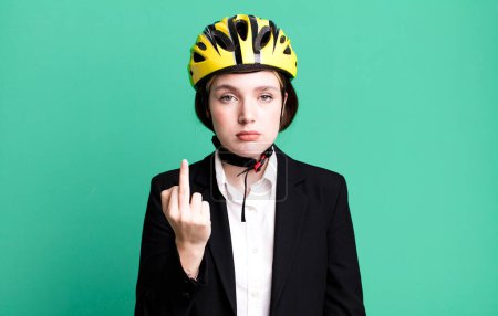 Photo for Young pretty woman feeling angry, annoyed, rebellious and aggressive. bike and businesswoman concept - Royalty Free Image