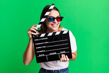 Photo for Young pretty woman with a cinema clapper. film or movie concept - Royalty Free Image