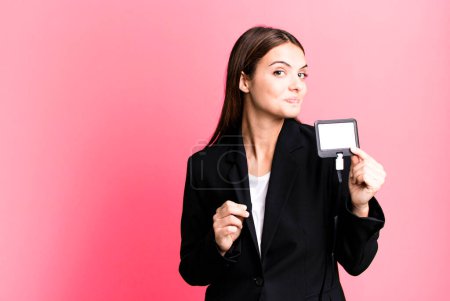 Téléchargez les photos : Young pretty woman with an id accreditation pass card - en image libre de droit
