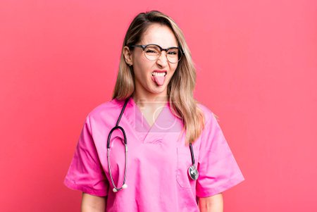 Photo for Feeling disgusted and irritated and tongue out. nurse concept - Royalty Free Image
