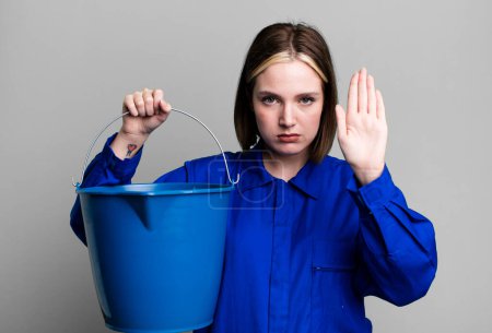 Photo for Young pretty woman. windows washer concept - Royalty Free Image