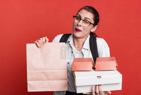 Foto de Young adult pretty woman with take away delivery fast food boxes - Imagen libre de derechos