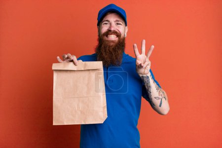 Photo for Young adult red hair bearded cool delivery man with a paper bag - Royalty Free Image