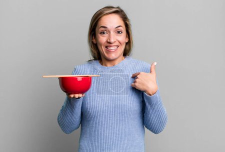 Photo for Pretty blonde woman feeling happy and pointing to self with an excited. japanese noodles concept - Royalty Free Image