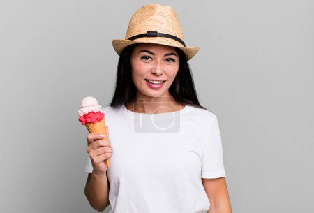 Téléchargez les photos : Hispanic pretty woman looking happy and pleasantly surprised. ice cream and summer concept - en image libre de droit