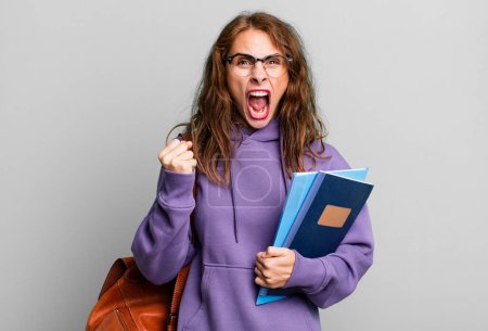 Photo for Hispanic pretty woman shouting aggressively with an angry expression. university student concept - Royalty Free Image