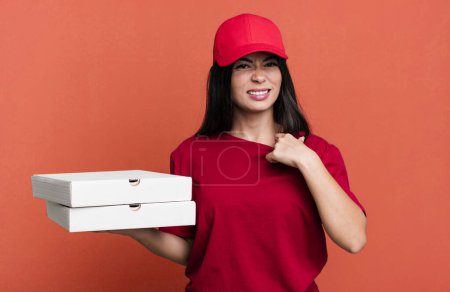 Photo for Hispanic pretty woman feeling stressed, anxious, tired and frustrated. delivery pizza concept - Royalty Free Image
