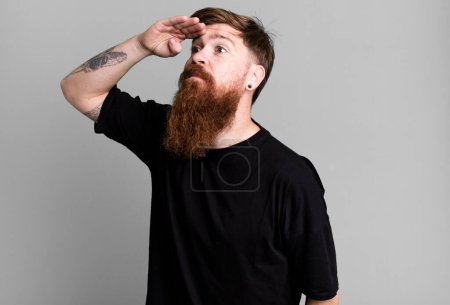 Photo for Long beard and red hair cool man wearing a simple shirt and with a copy space - Royalty Free Image