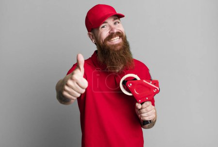 Photo for Long beard man feeling proud,smiling positively with thumbs up. shipping packer concept - Royalty Free Image
