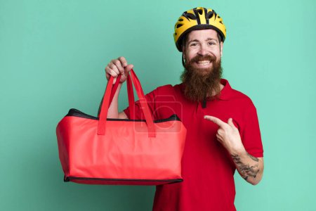 Photo for Long beard man looking excited and surprised pointing to the side. pizza delivery concept - Royalty Free Image
