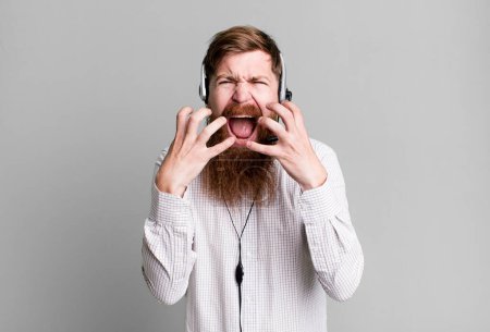 Photo for Long beard man looking desperate, frustrated and stressed. telemarketer agent concept - Royalty Free Image