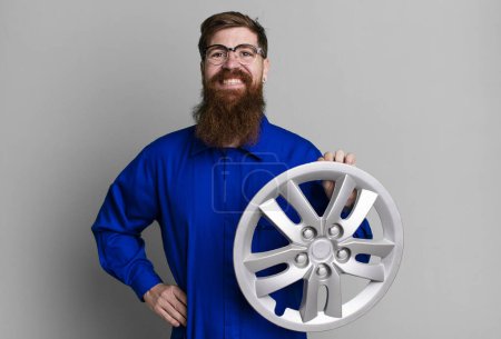 Photo for Long beard man smiling happily with a hand on hip and confident. car mechanic concept - Royalty Free Image