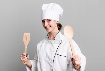 Téléchargez les photos : Caucasian pretty blonde woman. chef concept with wooden tools - en image libre de droit