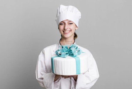 Photo for Caucasian pretty blonde woman. chef concept with a cake - Royalty Free Image