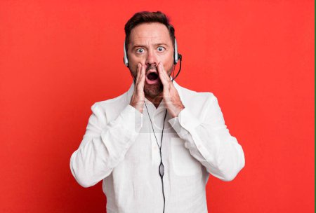 Photo for Middle age man feeling shocked and scared. telemarketer concept - Royalty Free Image