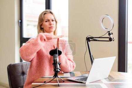 Photo for Pretty young woman working at home with a laptop. house interior design - Royalty Free Image
