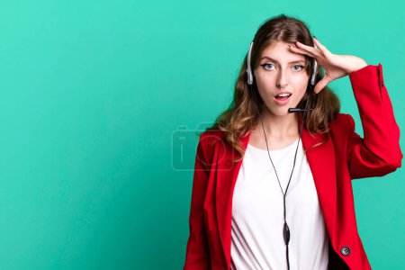 Photo for Caucasian pretty woman looking happy, astonished and surprised. telemarketer agent concept - Royalty Free Image