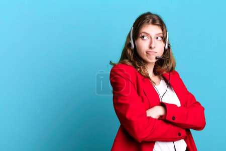 Photo for Caucasian pretty woman shrugging, feeling confused and uncertain. telemarketer agent concept - Royalty Free Image
