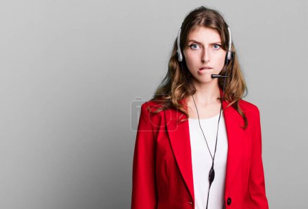 Photo for Caucasian pretty woman looking puzzled and confused. telemarketer agent concept - Royalty Free Image