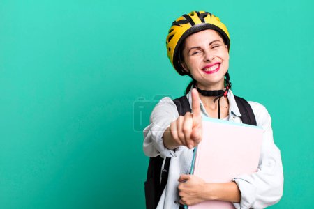 Photo for Pretty hispanic woman smiling proudly and confidently making number one. university student concept - Royalty Free Image