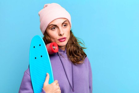 Photo for Hispanic pretty young woman. skateboard concept - Royalty Free Image