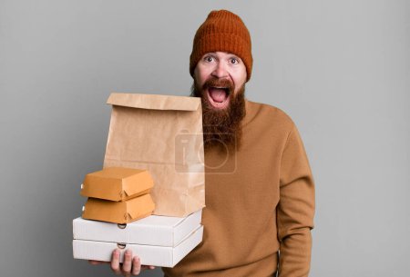 Photo for Long beard and red hair cool man. delivery and take away food concept - Royalty Free Image