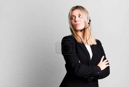 Photo for Young pretty woman shrugging, feeling confused and uncertain. telemarketer concept - Royalty Free Image