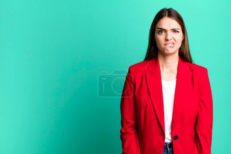 Photo for Young pretty woman looking puzzled and confused. businesswoman concept - Royalty Free Image