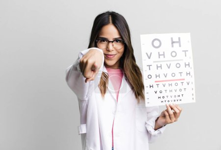 Photo for Hispanic pretty woman pointing at camera choosing you. optometry concept - Royalty Free Image