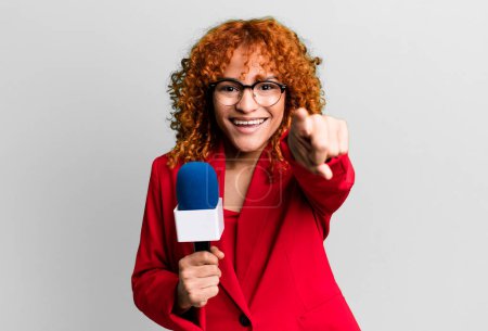 Photo for Red hair pretty woman pointing at camera choosing you. journalist and presenter concept - Royalty Free Image