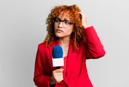 Photo for Red hair pretty woman smiling happily and daydreaming or doubting. journalist and presenter concept - Royalty Free Image